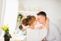 Happy positive young couple hugging in the kitchen Royalty Free Stock Photo