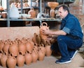 Happy potter at the workshop Royalty Free Stock Photo