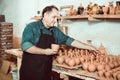 Happy potter at the workshop Royalty Free Stock Photo