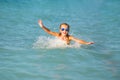 Cute young girl playing in the sea. Royalty Free Stock Photo