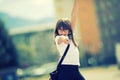 Happy pre-teen young girl. Cute little girl in the city on a sunny day. Portrait young girl. Toned image Royalty Free Stock Photo