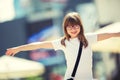 Happy pre-teen young girl. Cute little girl in the city on a sunny day. Portrait young girl. Toned image Royalty Free Stock Photo