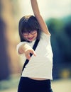 Happy pre-teen young girl. Cute little girl in the city on a sunny day. Portrait young girl. Toned image Royalty Free Stock Photo