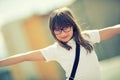 Happy pre-teen young girl. Cute little girl in the city on a sunny day. Portrait young girl. Toned image Royalty Free Stock Photo