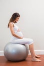 Happy pregnancy sitting on exercice ball