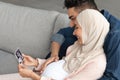Happy Pregnant Arabic Woman And Her Husband Looking At Baby Sonogram Picture Royalty Free Stock Photo