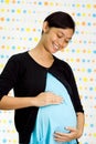 Happy pregnant asian ethnic woman