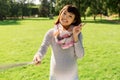 Happy pregnant asian woman taking selfie at park Royalty Free Stock Photo