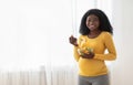 Happy pregnant black woman eating fresh salad at home Royalty Free Stock Photo