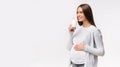 Happy Pregnant Girl Drinking Milk On Gray Studio Background, Panorama Royalty Free Stock Photo