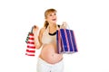 Happy pregnant holding shopping bags in hands Royalty Free Stock Photo