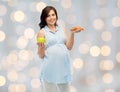 Happy pregnant woman with apple and croissant Royalty Free Stock Photo
