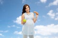 Happy pregnant woman with apple and croissant Royalty Free Stock Photo