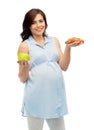 Happy pregnant woman with apple and croissant Royalty Free Stock Photo