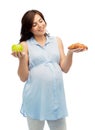 Happy pregnant woman with apple and croissant Royalty Free Stock Photo