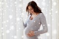 Happy pregnant woman with big tummy at home Royalty Free Stock Photo