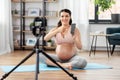 Happy pregnant woman blogger recording yoga video Royalty Free Stock Photo