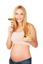 Happy pregnant woman with cake and pickles Royalty Free Stock Photo