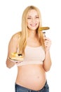 Happy pregnant woman with cake and pickles Royalty Free Stock Photo