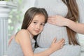 Happy pregnant woman with daughter Royalty Free Stock Photo