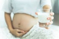 Happy pregnant woman drinking a glass of fresh milk Royalty Free Stock Photo