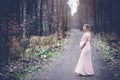 Happy pregnant woman enjoying walk in forest Royalty Free Stock Photo