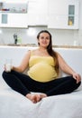 Happy pregnant woman giving a thumbs up Royalty Free Stock Photo