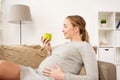 Happy pregnant woman with green apple Royalty Free Stock Photo