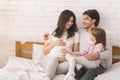 Happy Pregnant Woman, Her Husband And Daughter Lying Together In Bed Royalty Free Stock Photo