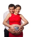 Happy pregnant woman and her husband with sonogram scan of their