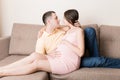 Happy pregnant woman and her husband waiting for baby at the home. happy family love and care concept Royalty Free Stock Photo