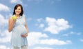 Happy pregnant woman holding green apple Royalty Free Stock Photo