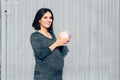 Happy Pregnant Woman Holding Piggy Bank Royalty Free Stock Photo