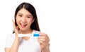 Happy pregnant woman holding pregnancy test and get happy and good news that asian woman has baby with smiley face. Young Mother w Royalty Free Stock Photo