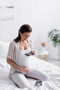 happy pregnant woman holding ultrasound scan. Royalty Free Stock Photo