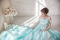 Happy Pregnant woman in long evening dress touching belly hands. Waiting the birth of a child, a woman in her eighth month Royalty Free Stock Photo