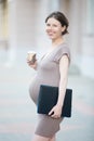 Happy pregnant woman office employee