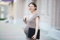 Happy pregnant woman office worker