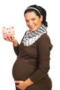 Happy pregnant woman with piggy bank Royalty Free Stock Photo