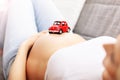 Happy pregnant woman resting on sofa Royalty Free Stock Photo