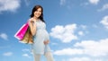 Happy pregnant woman with shopping bags Royalty Free Stock Photo