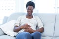 Happy pregnant woman sitting at home Royalty Free Stock Photo