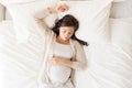 Happy pregnant woman sleeping in bed at home Royalty Free Stock Photo