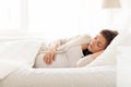 Happy pregnant woman sleeping in bed at home Royalty Free Stock Photo