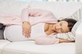 Happy pregnant woman sleeping on sofa at home Royalty Free Stock Photo