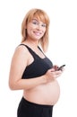 Happy pregnant woman texting or sending sms Royalty Free Stock Photo