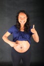 Happy pregnant woman with thumb up Royalty Free Stock Photo