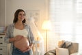 Happy pregnant woman touching her belly Royalty Free Stock Photo