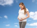 Happy pregnant woman touching her big belly Royalty Free Stock Photo