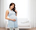 Happy pregnant woman touching her big belly Royalty Free Stock Photo